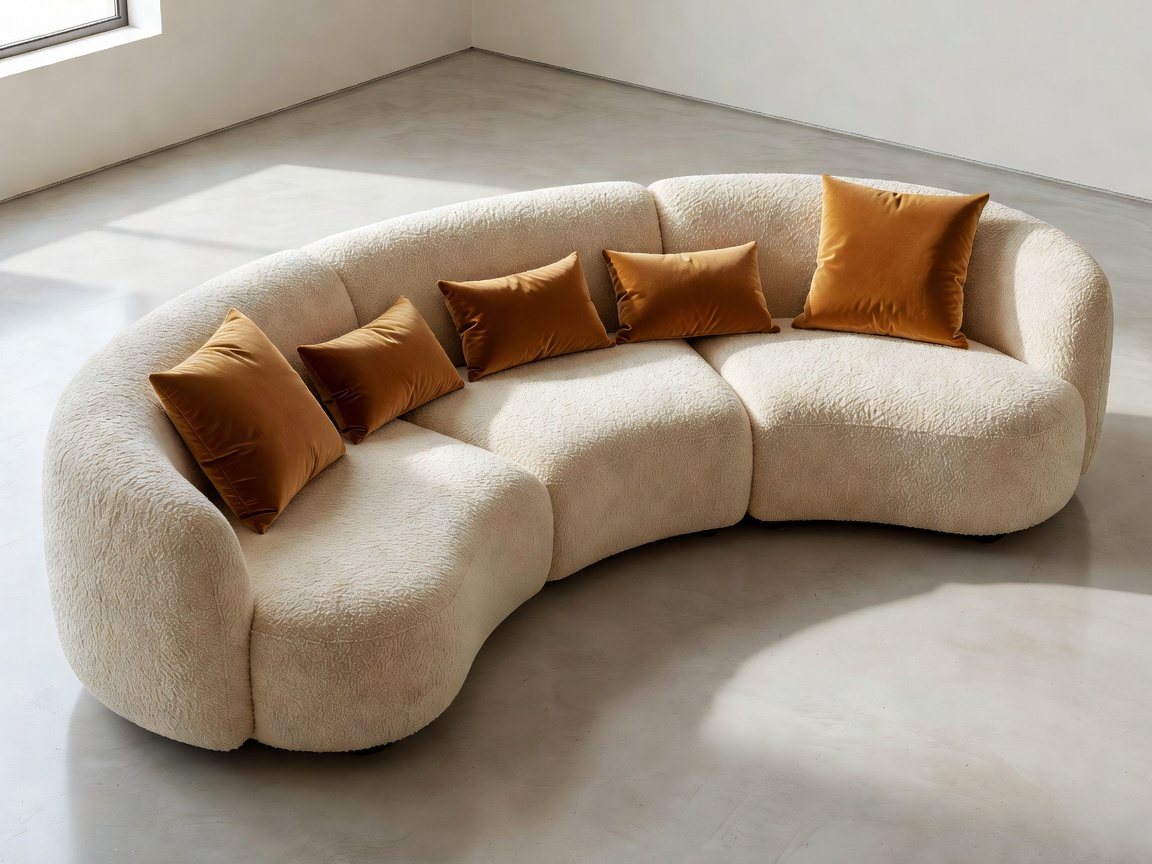 Grand architectural living room with sculpted modular seating, sunlight grazing high ceilings, and refined contemporary appointments